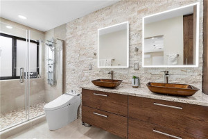 NEW primary bathroom with limestone accent wall.