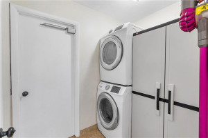 Laundry ROOM has full sized SAMSUNG washer & dryer.