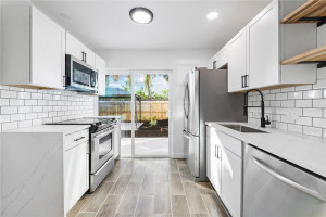New solid wood shaker cabinetry, subway tile backsplash