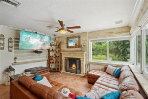 Enjoy a Spacious Family Room with Fireplace, Pool and Nature Preserve Views
