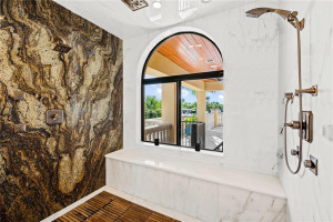 MASTER BATH WITH DESIGNER FINISHES AND SLAB WALLS