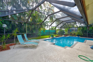 The enclosure has just been re-screened - with 2 patio doors for easy access to your private yard. The enclosure has just been re-screened - with 2 patio doors for easy access to your private yard.