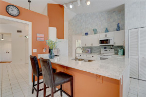 Enter into your updated kitchen. White wood cabinetry, quartz countertop, glass backsplash Enter into your updated kitchen. White wood cabinetry, quartz countertop, glass backsplash