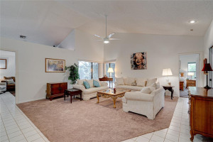 Formal living room offers 2 sets of sliding glass doors for view of pool and lake! Formal living room offers 2 sets of sliding glass doors for view of pool and lake!