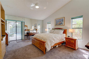 Primary Bedroom has Doors to screened patio. This spacious master has room for sitting area Primary Bedroom has Doors to screened patio. This spacious master has room for sitting area