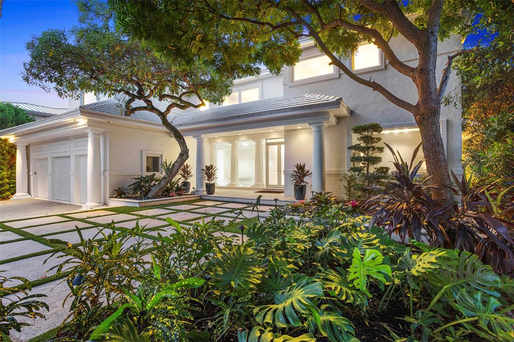 Stunning waterfront updated home with 3 car garage, warmth, and natural lighting throughout.