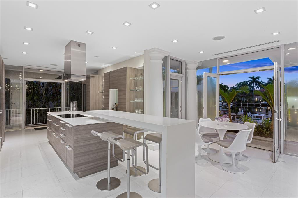 Modern Poggenpohl kitchen exits to the side path and backyard for multiple points of entry.