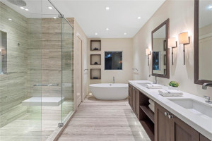 Primary spa bathroom complete with tub and shower.