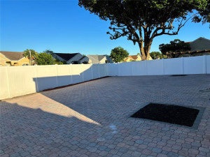 Back the property with pavers and PVC fenced in yard. Back the property with pavers and PVC fenced in yard.