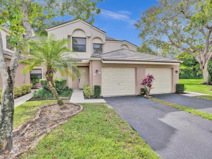 Gorgeous townhouse with new kitchen, flooring and soon new Impact windows and a 1 car garage.