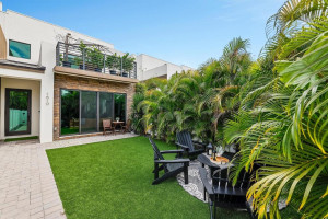 Private balcony off master bedroom over looks the private fenced yard. Artificial Turf makes this space easy to enjoy.