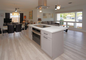 Kitchen boasting a spacious cooking/eating island with new stainless steel appliances and induction cooktop.