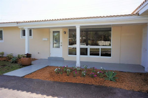 Welcoming front entry with impact glass and brand new impact door.