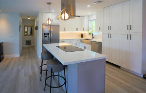 Spacious open floor plan kitchen with island, plenty of counter space, farm sink, and plenty storage.