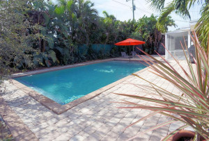 saltwater pool in the spacious back yard has a "beach" and water feature.