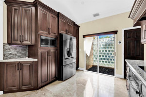 Photo for 9975 SW 59th Court, Cooper City, FL 33328 - Listing #FX-10426005 Ambient lighting under & above cabinets & Black SS appliances