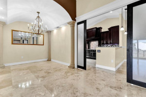 overlooking the kitchen/family rm area with frosted french doors for privacy