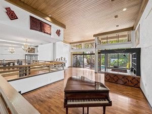 Living Room with Volume Ceilings & Functional Fireplace