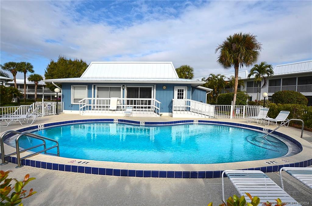 Clubhouse with one of 3 swimming pools