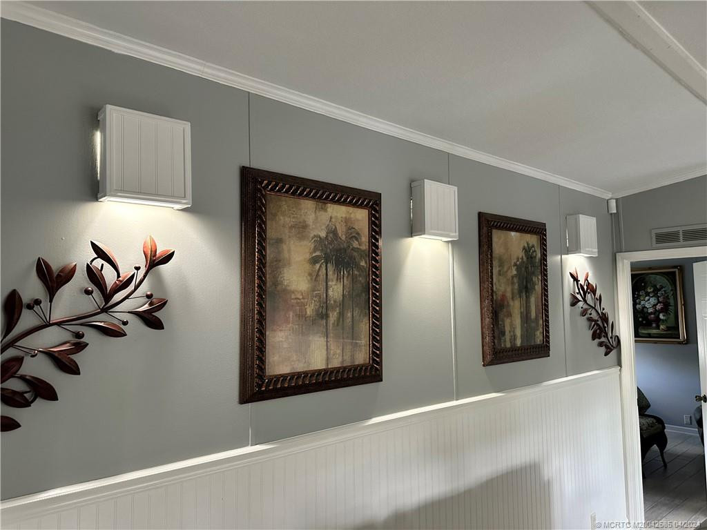 Wainscoting and sconce lights, crown molding