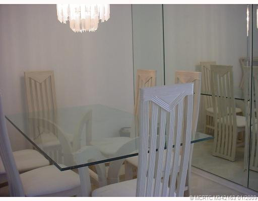 Dining Room. Large mirrored wall in dining room.