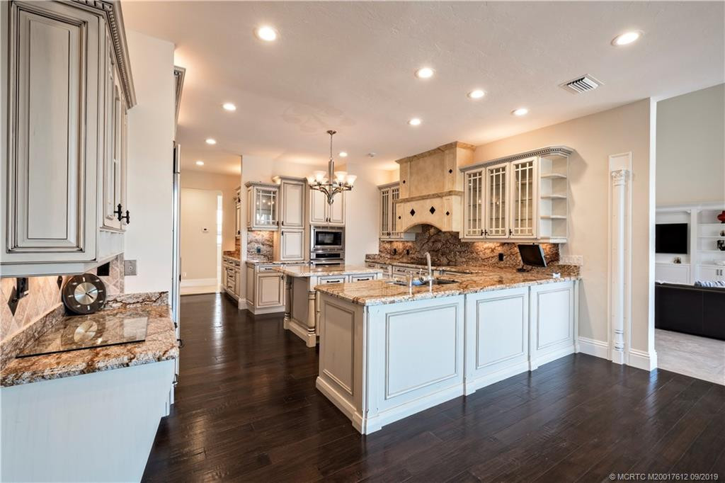 Well planned eat in kitchen with hardwood floors.