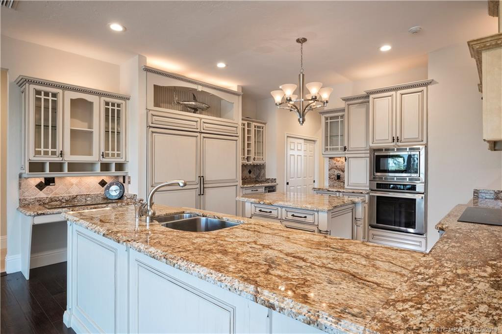 Thermador appliances, Subzero side by side refrigerator/freezer, Butler's pantry and wine storage.