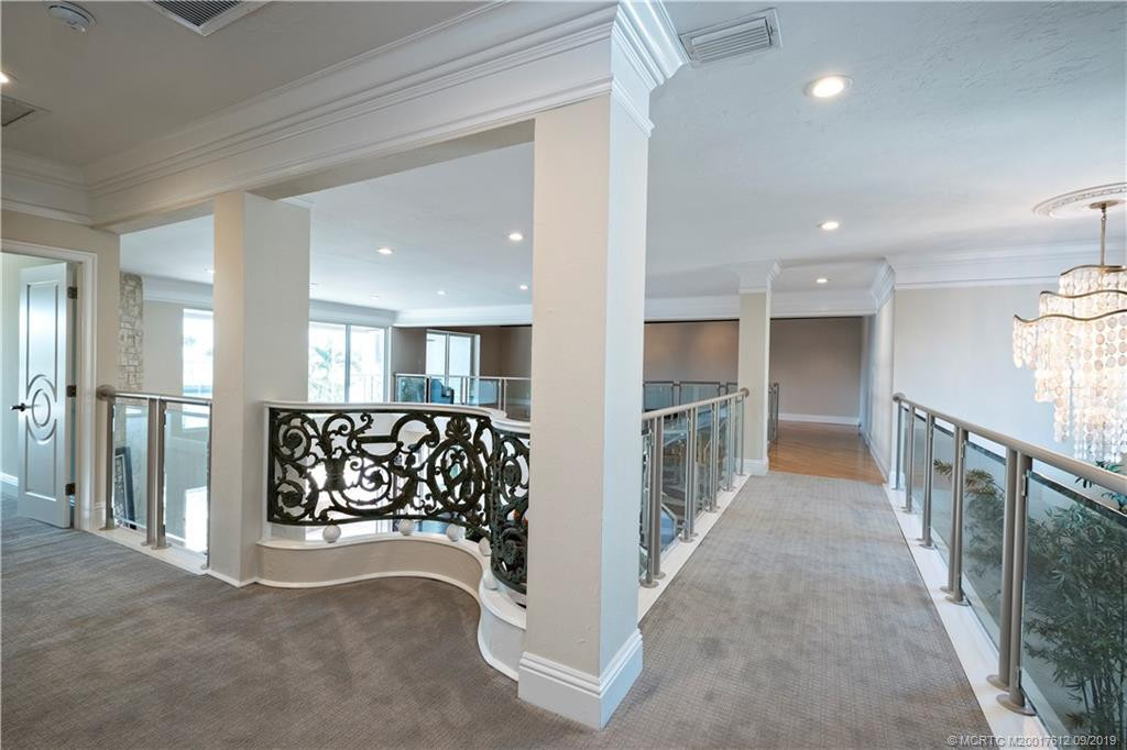 Second level offers a large open loft and VIP guest ensuite with fireplace and private balconies.