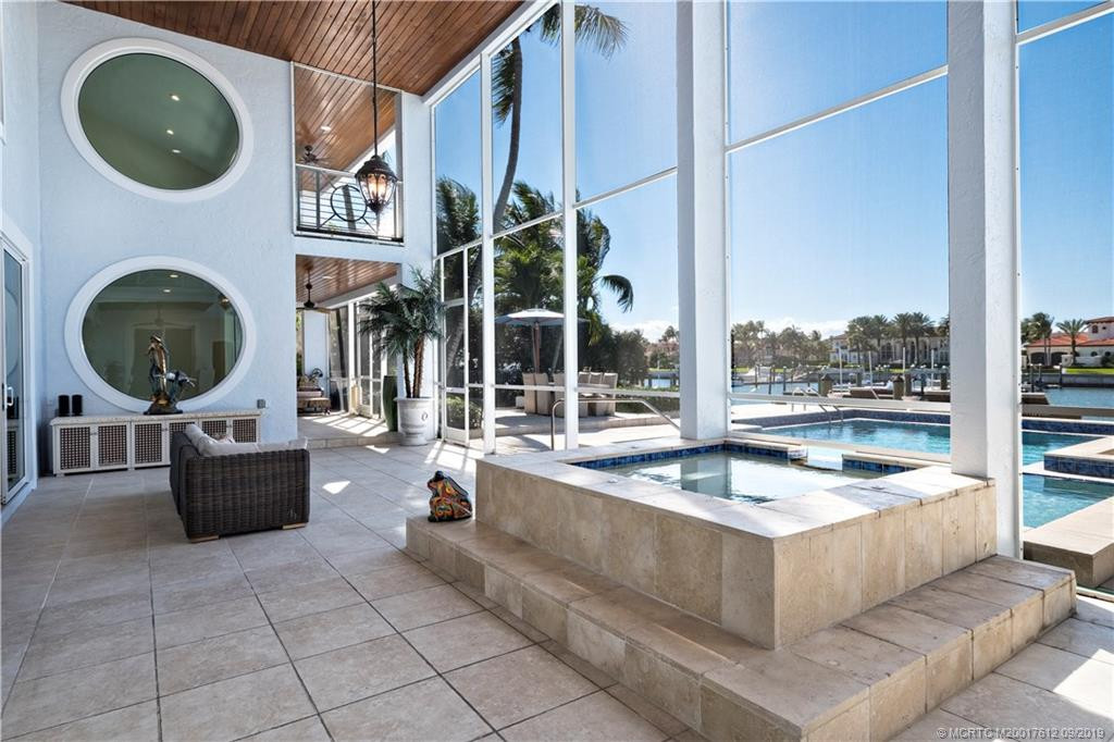 Screened lanai with spa. TV in place to watch as you relax or jump in the spa!