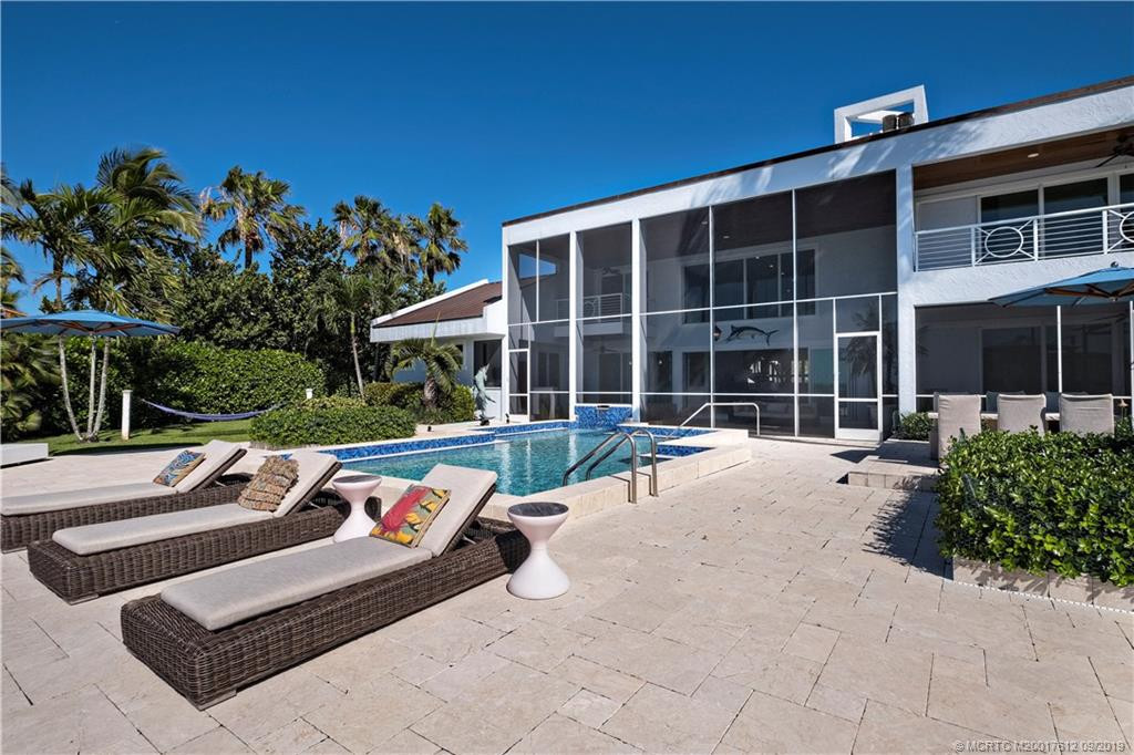 Pool deck with Travertine stone to water's edge.
