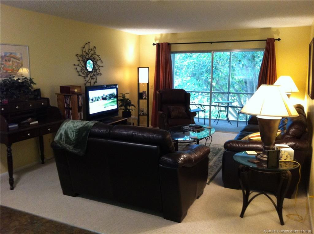 Living room w/TV overlooking porch