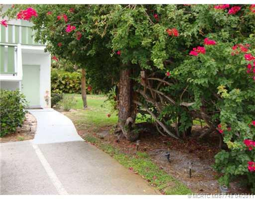 Exterior Front. Walkway from Parking to Condo