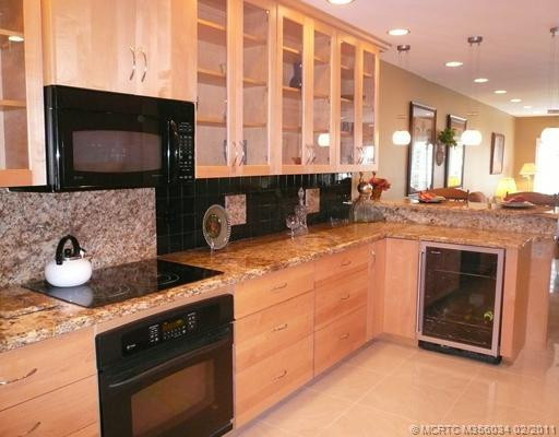 Kitchen. Top-of-the-line GE appliances, Marvel wine refrigerator & Lazy Susan are special features of this elegant, all new, extended & expanded granite kitchen