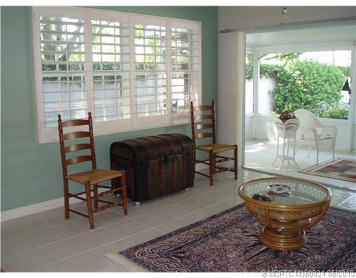 Den/Family/Great Room. FAMILY ROOM OVERLOOKING SCREENED PORCH AND OPEN TO KITCHEN- NICE PLANTATION SHUTTERS IN THIS ROOM ALSO