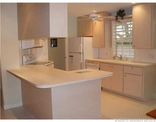 Kitchen. CAPRI KITCHEN IS THE HEART OF THIS HOME AND IT IS IMMACULATE WITH PLANTATION SHUTTERS