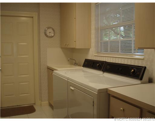 Other. LARGE UTILITY ROOM WITH NATURAL LIGHT, LOTS OF STORAGE AND UTILITY SINK-ROOM LEADS TO LARGE 2 CAR GARAGE