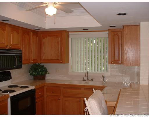 Kitchen. Oak Cabinets and Tiled Snack Counter-updated in 2003.