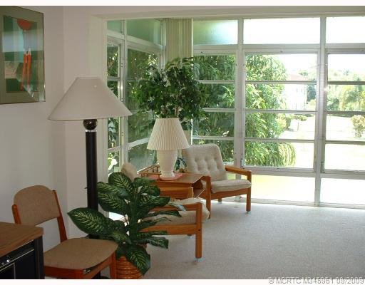 Living Room. Living Room and Enclosed Porch are open. Makes a Beautiful Area.