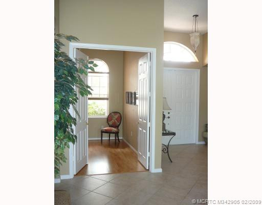 Studio/Study/Office. Double doors enter into office/den with wood floors. Dual doors open to formal living area.