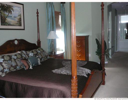 Master Bedroom. Large master suite opens to pool patio, with large walk in closet, dressing area enroute to master bath.