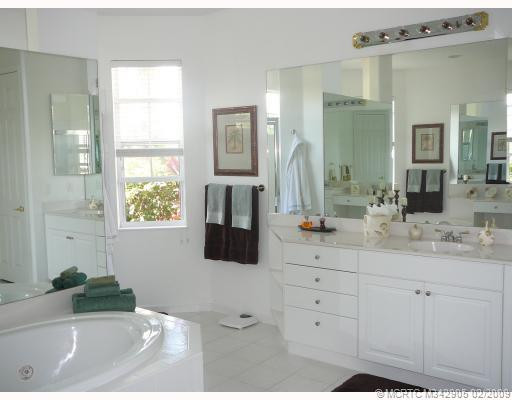 Master Bath/Spa. Large master bath with private water closet, dual sinks, jacuzzi tub, dual walk through shower, elegance and luxury.