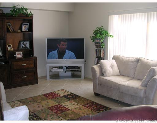 Living Room. TILE FLOORS, LARGE SLIDING DOORS AND AMPLE ROOM TO ENJOY A WONDERFUL LIFE STYLE