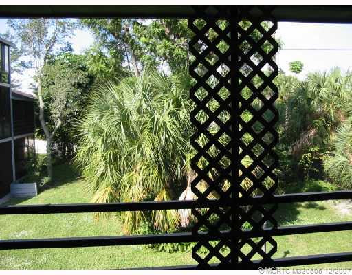 Patio/Deck. Large screened porch looks over trees and green area.