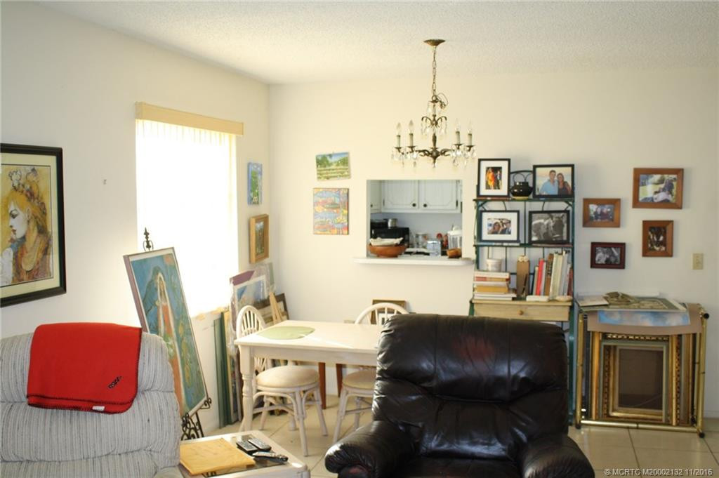 The dining room is open to the living room and there is a convenient pass-through from the kitchen to the dining room.