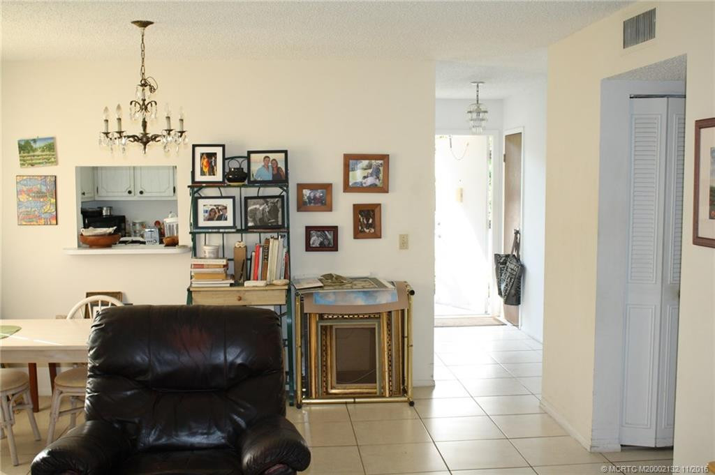 The dining room is conveniently open to the living room with a pass through to the kitchen.