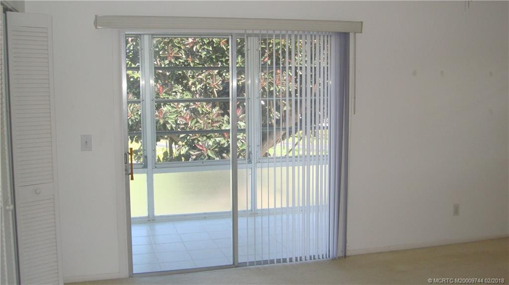 Sliding doors from the master bedroom to the enclosed porch.