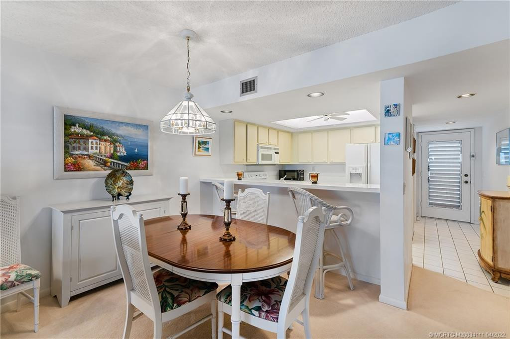 Dining Area facing Kitchen and Entrance