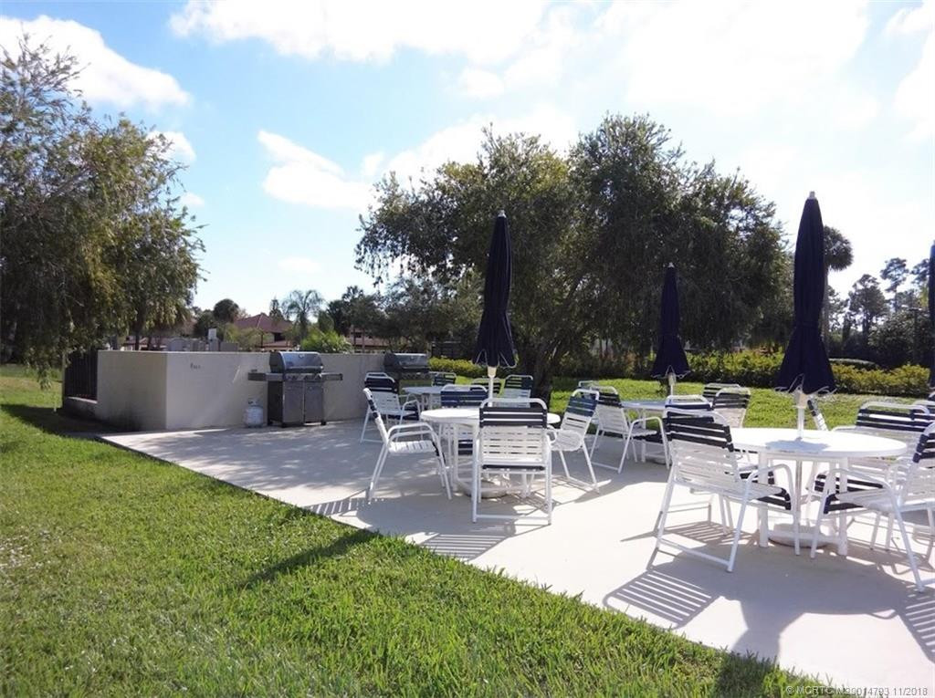 BBQ grill and tables across from your court.