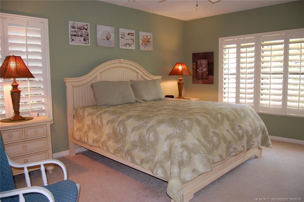The master is a sweet retreat with plantation shutters for ambience and privacy.