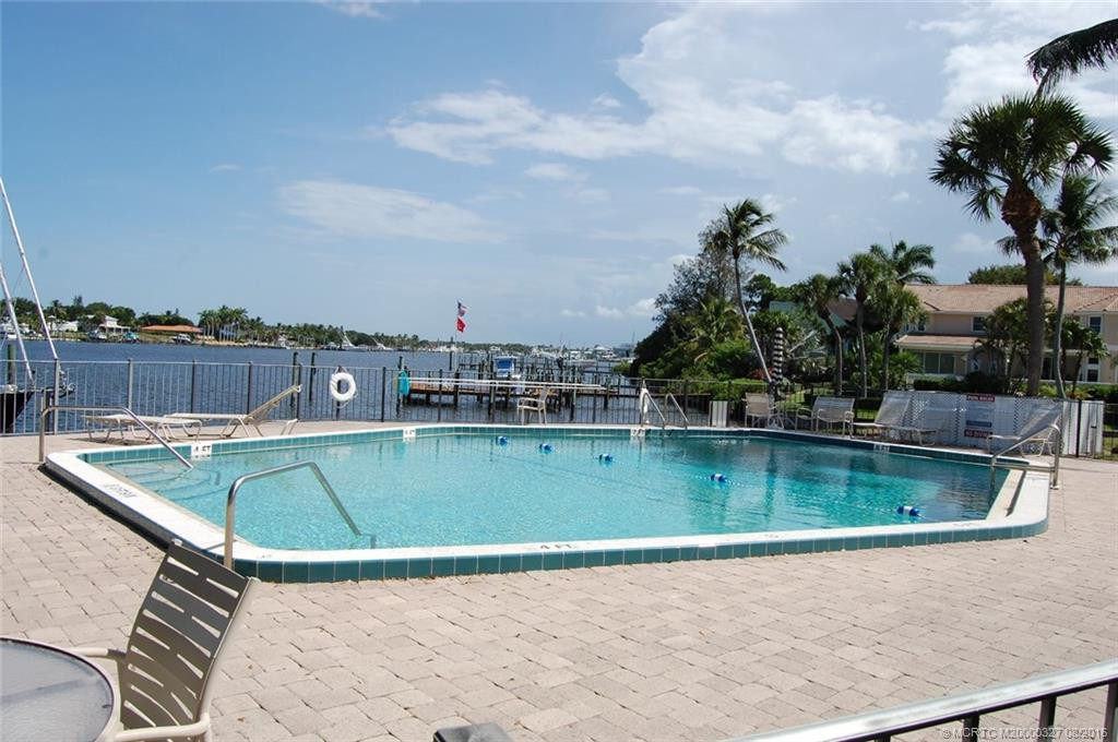 A glistening community pool at water's edge looks really inviting!